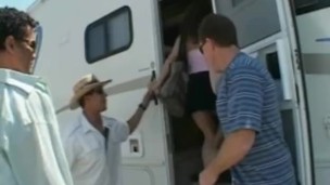 Nasty babe gets banged in the van with three big cocks