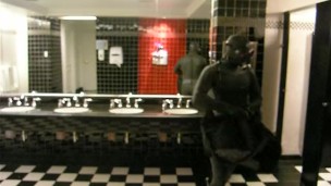 Thief changes into fully lubed rubber gear in public washroom