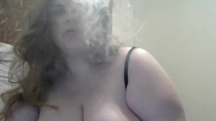 Huge DDD tit wife smokes while playing with her big tits and hard nipples