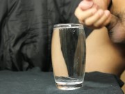 cumming in a glass of water