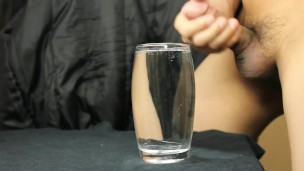 cumming in a glass of water