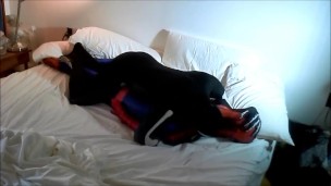 skeleton humps spiderman on his white bed