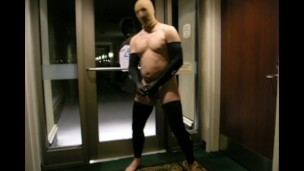 stocking masked biker jerks off in hotel hall