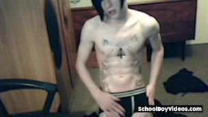 Tattood twink plays with his fat uncut dock
