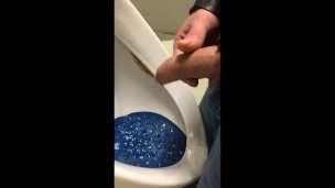 dirty boy pissing in dirty urinal