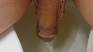 Man peeing sitting down...Pov