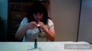 Smoking tranny paints her nails