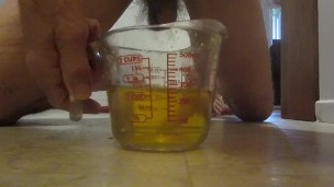 Pissing in a measuring cup!