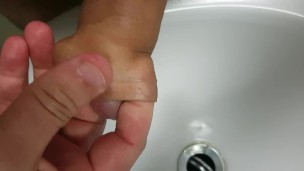 Pissing into my foreskin before massaging my glans to orgasm