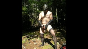 jerking off outside in stockings, long gloves and gasmask