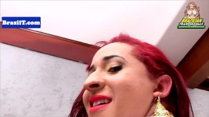 Redhead brazilian tranny wanking her cock