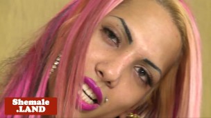 Pinkhair tgirl tugging cock on bed