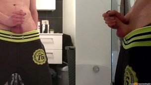 teen boy is urinating in the bathroom