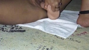 Asian fucking her toy with nipple clamps