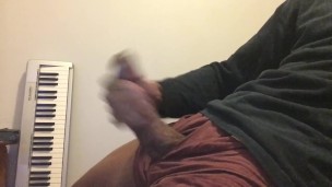 BIG LATINO COCK STROKES AND CUMS ALL OVER HIMSELF.