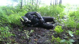 frogman quickly jerks off in shallow mud