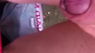 chav pissing and wanking in a field