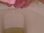 Playing with my hairy pussy while pissing on the toilet