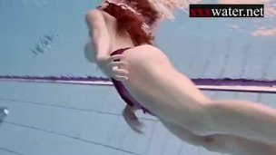 Smoking hot Russian redhead in the pool