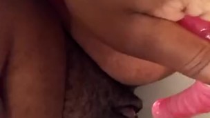 Peeing on pink dildo