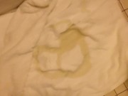 Pissing circles on a towel
