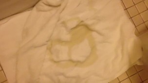Pissing circles on a towel
