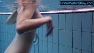 Hot blondie in stockings swims