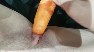 Sexy slut fucking herself with a carrot