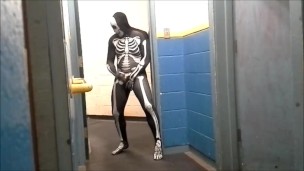 skeleton with hard on jerks off in gym hall