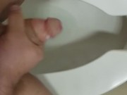 Jerking off in a public toilet
