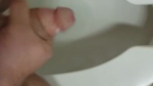 Jerking off in a public toilet