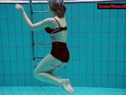 Tattooed baby swirls underwater
