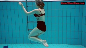Tattooed baby swirls underwater