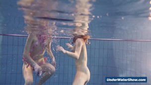 Horny girls strip eachother in the pool