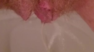 Close up hairy pussy piss and rub on toilet