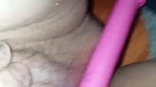 Sexy redhead fucks her juicy ginger pussy wearing glasses