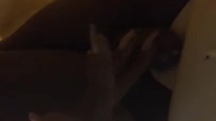 TS sits on couch and rubs hard clit