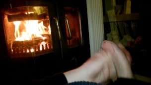 A wank by the fireplace.