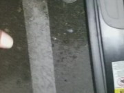Cumming in public in a parking lot outside