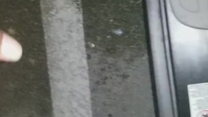 Cumming in public in a parking lot outside