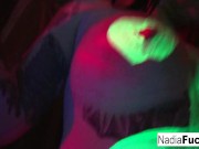 Black-light babes Nadia and Ophelia suck off a colorful cock