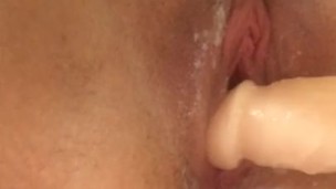 Teen uses dildo