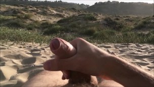 Masturbating on nudist beach. Slowmotion cumshot