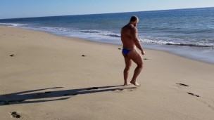 Beach walking in tiny bikini