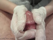 Jerking him off in latex gloves
