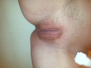 Teen shaves her hairy pussy with an electric razor in the shower.