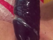Gentle mastebating with huge dildo