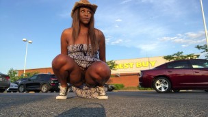 Peeing at crowded Best Buy parking lot.
