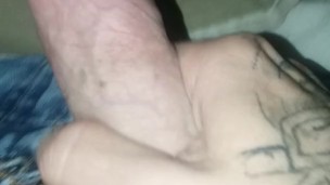 Tattooed guy jerking off