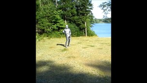 armed zentai skeleton outdoors in the sun